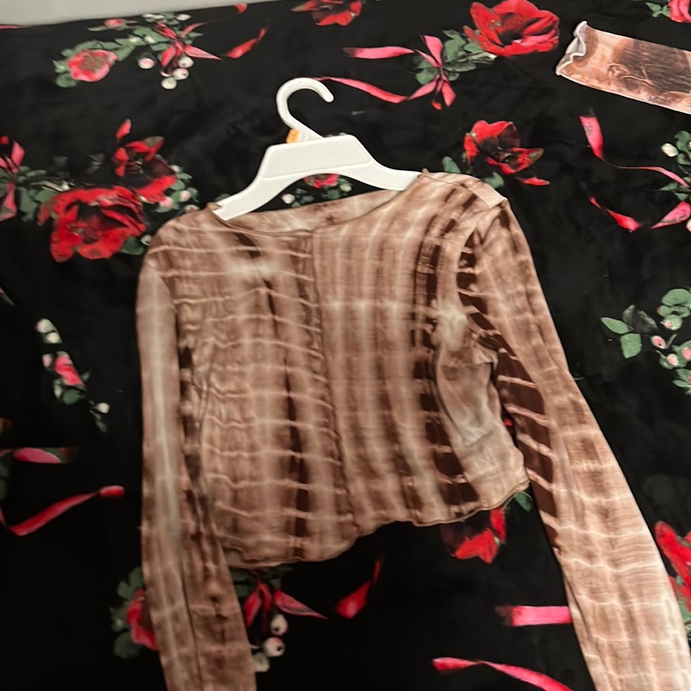 A brown/tan long sleeve soft top.